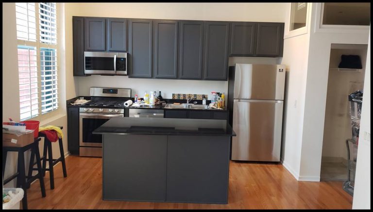 Kitchen cabinets: one coat of primer and three coats of urethane enamel. Color dark gray. Painting contractor. West Loop. Wicker park. Downtown. West Town