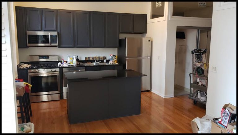 Kitchen cabinets: one coat of primer and three coats of urethane enamel. Color dark gray. Painting contractor. West Loop. Wicker park. Downtown. West Town